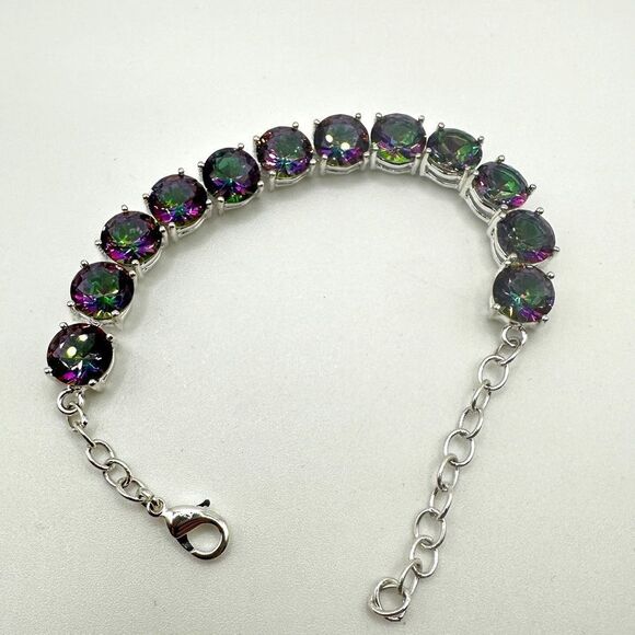 No Brand Jewelry - Genuine round cut mystic topaz in silver tone tennis bracelet!